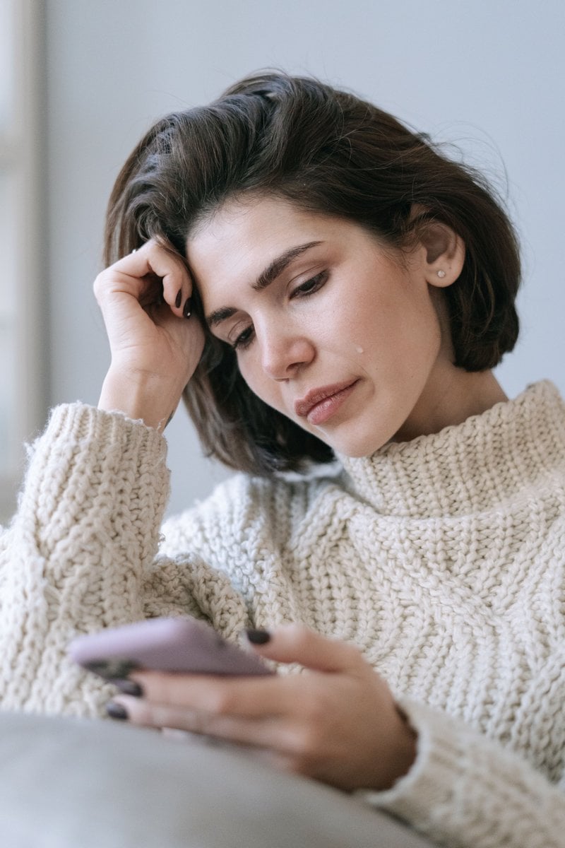 A Woman Crying While Looking at Her Phone &middot; Free Stock Photo