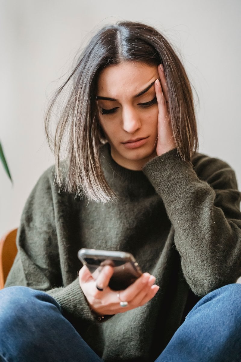 A Woman Crying While Looking at Her Phone &middot; Free Stock Photo