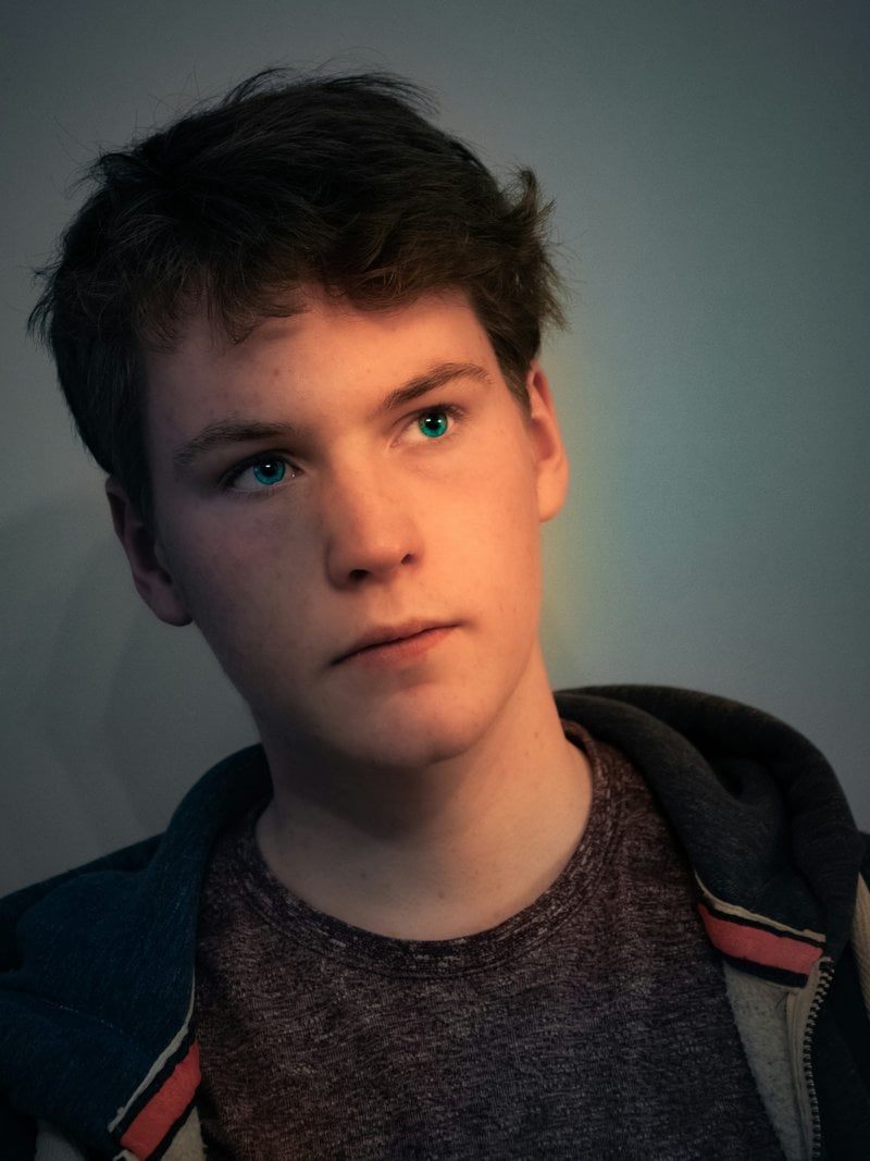 A young man with a serious look on his face photo &ndash; Free Face Image on  Unsplash