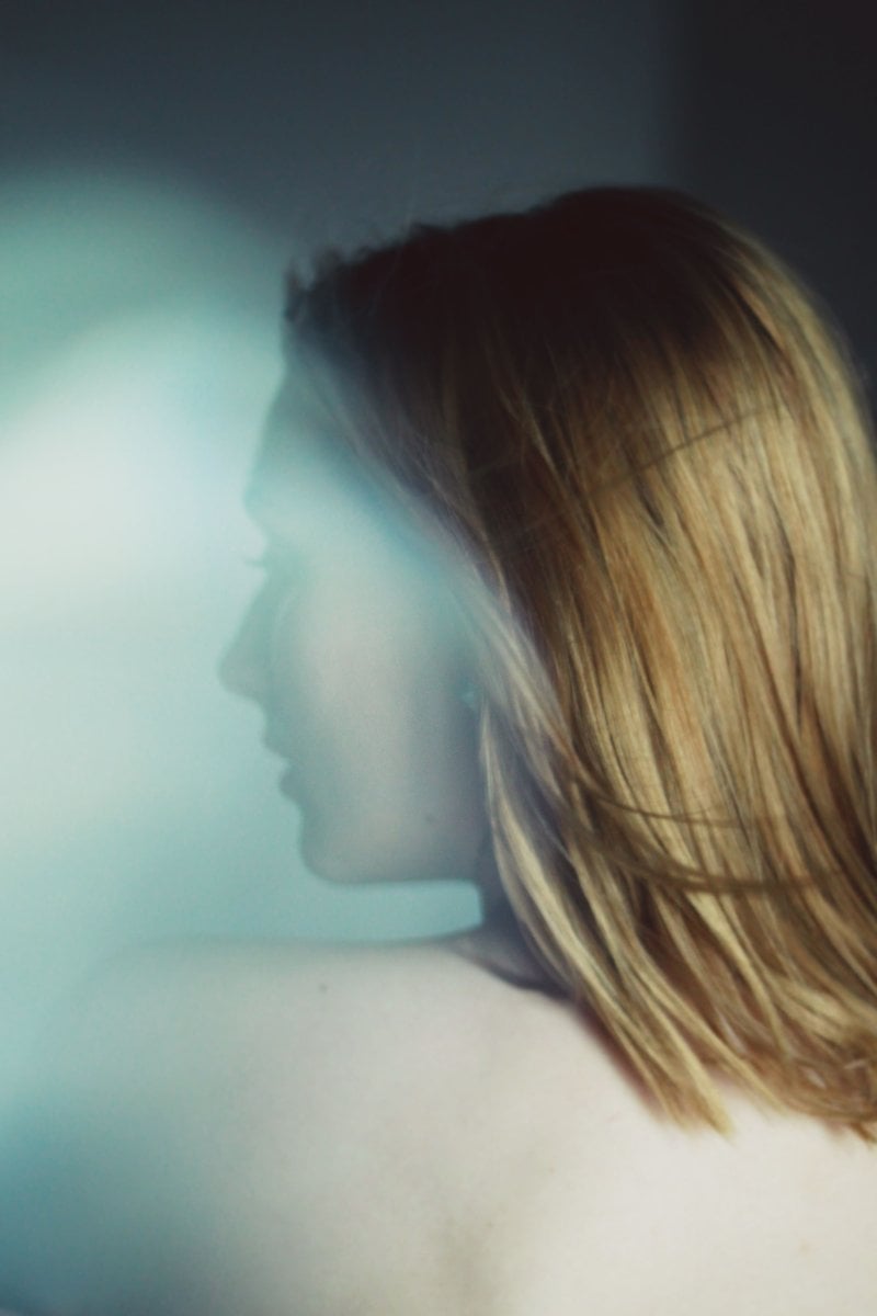 Dark Abstract Photograph of a Woman with Blond Hair &middot; Free Stock Photo