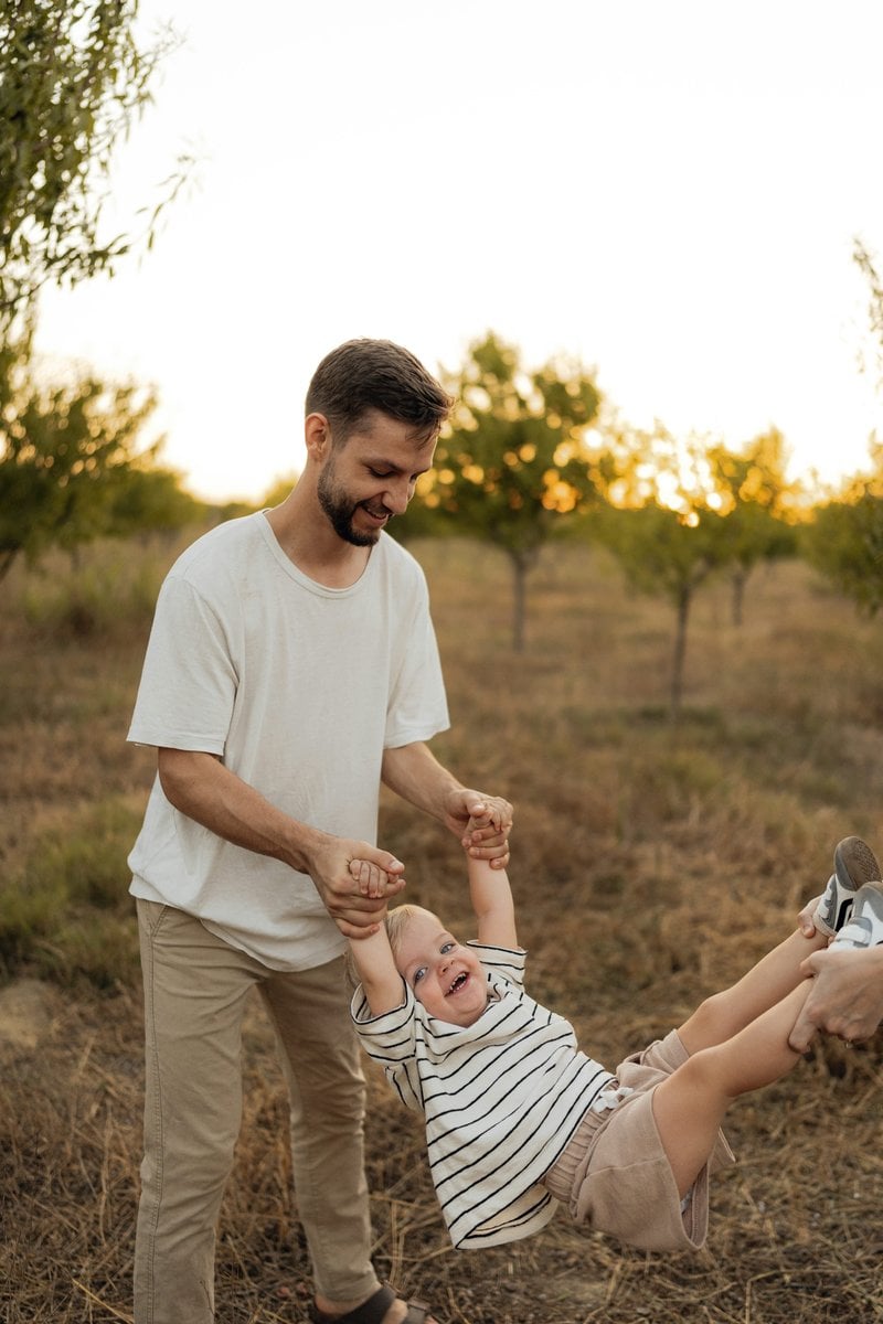 Father swinging happy child in an orchard photo &ndash; Free Green Image on  Unsplash