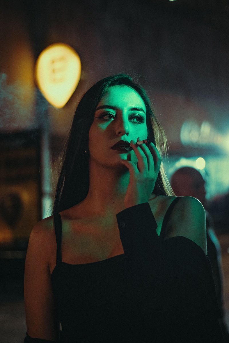 Moody Urban Night Portrait of Contemplative Woman &middot; Free Stock Photo