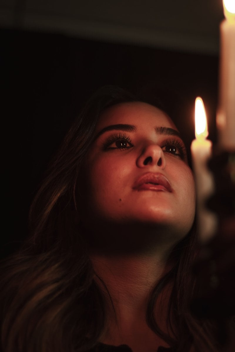Portrait of Woman by Candlelight in Dark Setting &middot; Free Stock Photo