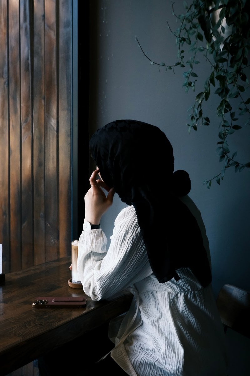 Woman Sitting Behind Desk Wearing Turban &middot; Free Stock Photo