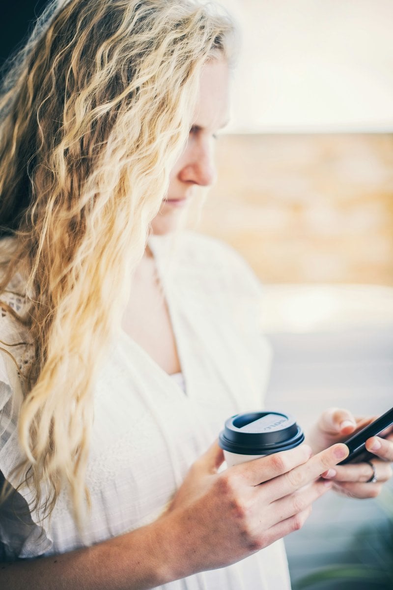 Woman in white shirt holding black cup photo &ndash; Free Woman Image on Unsplash