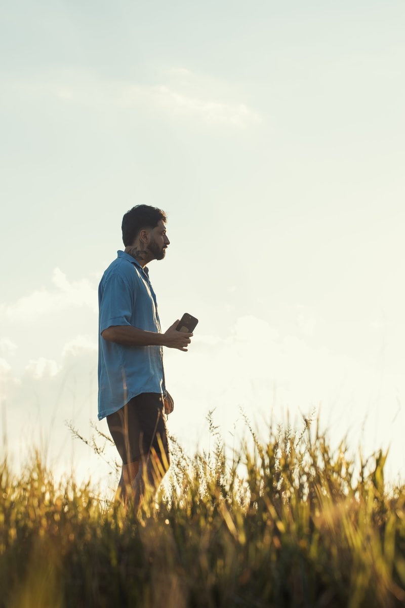 Man Walking in Field at Golden Hour &middot; Free Stock Photo