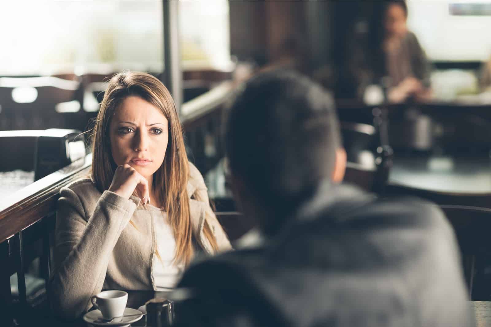 a disappointed woman talking to a man