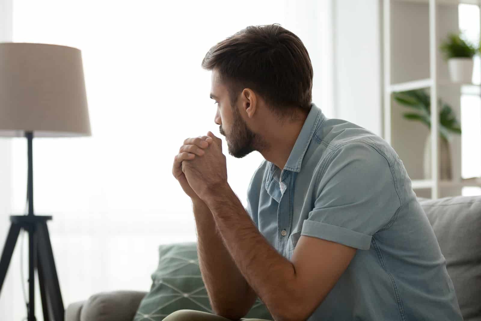 an imaginary man sitting on the couch