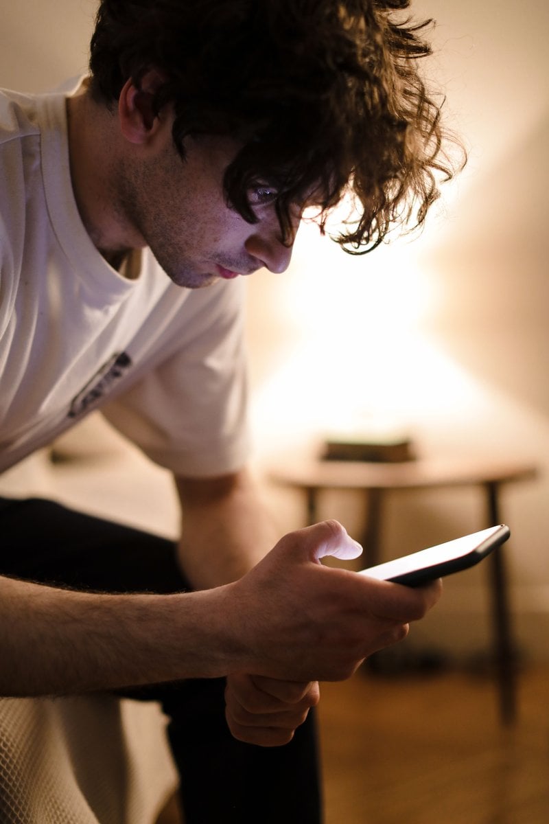 A Man Sitting on the Bed &middot; Free Stock Photo