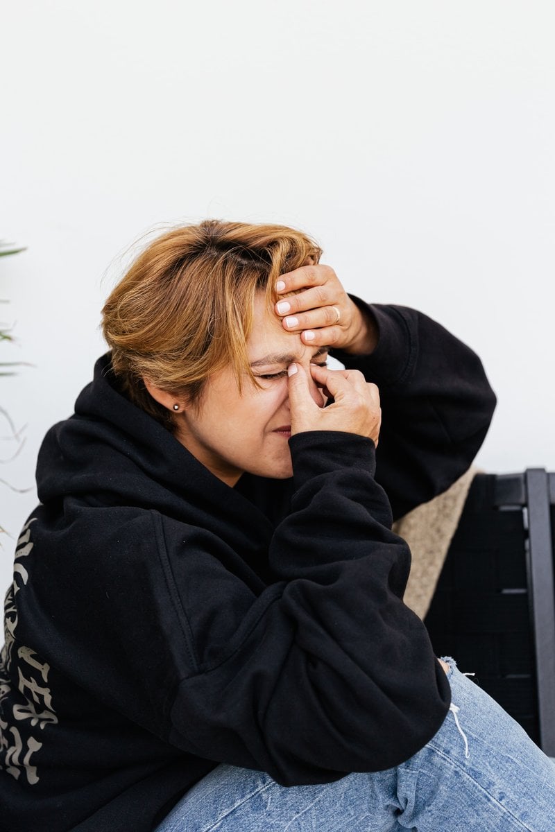 A Woman Feeling Pain on Her Nose &middot; Free Stock Photo