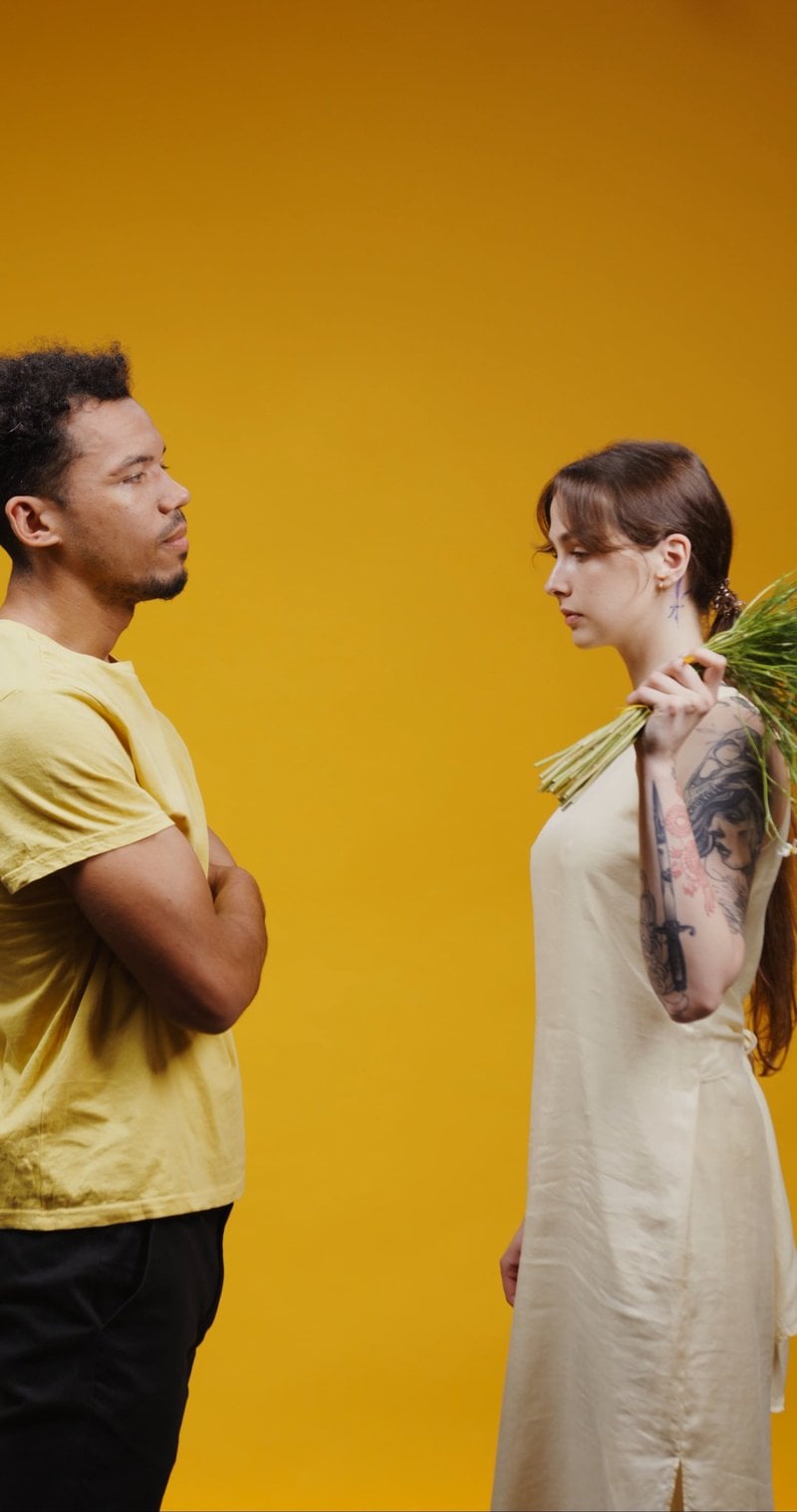 An Angry Woman Hitting a Man with Flowers